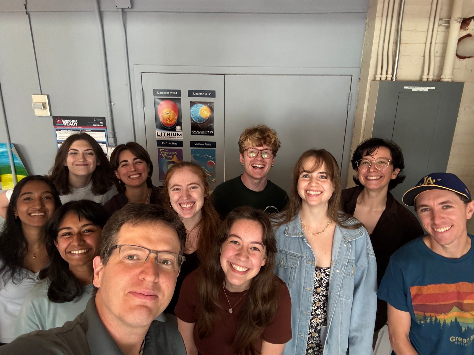 The Young Worlds Team in September 2026, eleven people posing together indoors